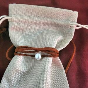 Fresh water pearl with leather cord